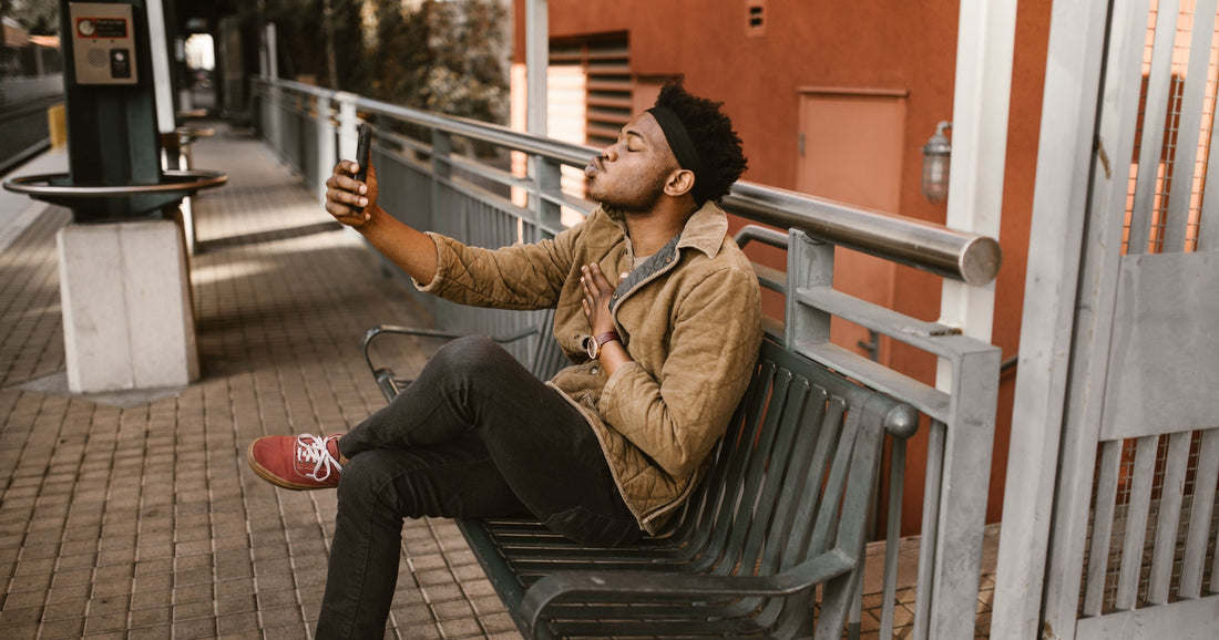 Man kissing his budget-friendly phone under £200 from FGU