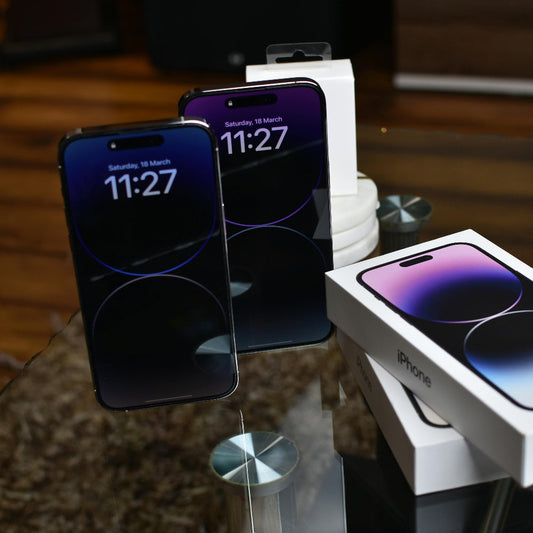 iphones on lockscreen with boxes on the table