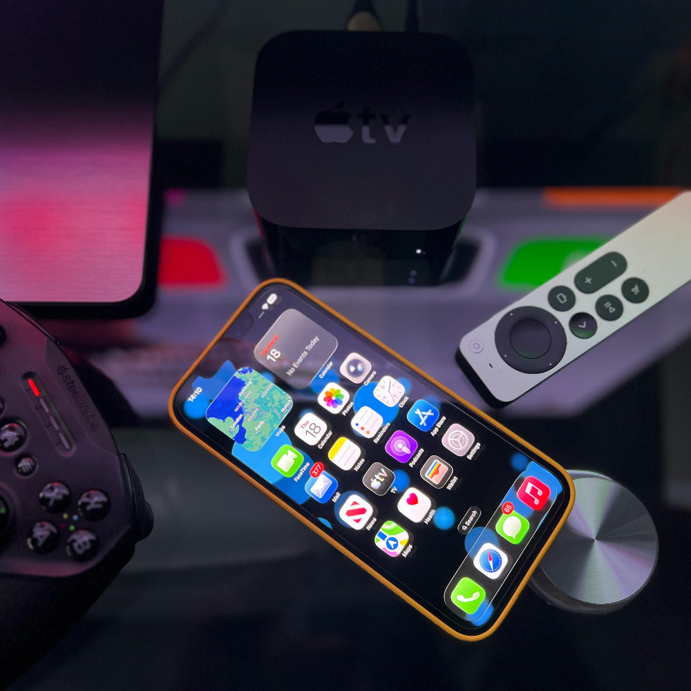 iPhone 12 Apple TV and remote on a table