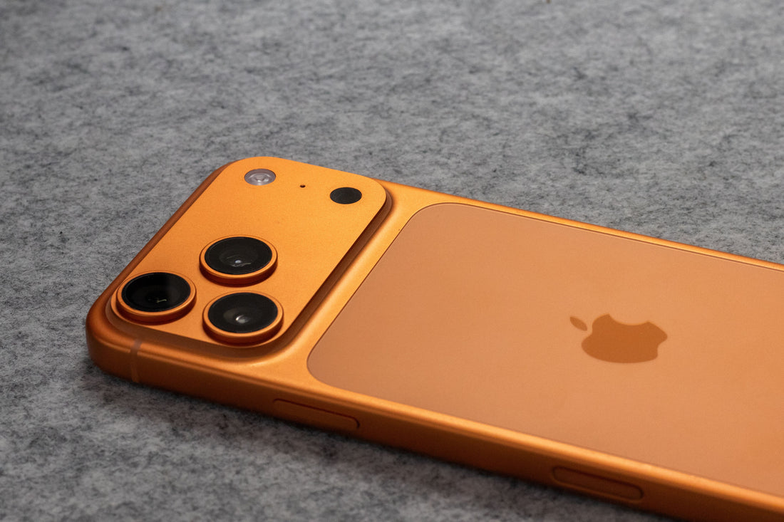 Apple iPhone 17 in orange lying on the ground, comparison to iPhone 16 series