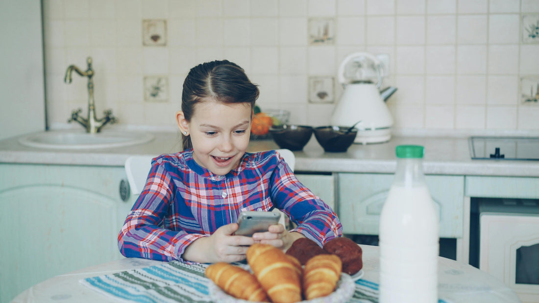 child preteen girl taking pictured of croissants with smartphone